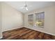 Bedroom with light walls, a ceiling fan and hardwood floors and view from 2 windows at 501 Fairmont Ter, Port Charlotte, FL 33954