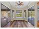 Bright breakfast nook with hardwood floors and views of the pool and backyard at 501 Fairmont Ter, Port Charlotte, FL 33954