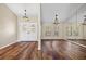 Spacious living room area with hardwood floors, glass window accents and ample sunlight at 501 Fairmont Ter, Port Charlotte, FL 33954