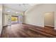 Bright living room featuring hardwood floors, high ceilings and access to the outdoor pool area at 501 Fairmont Ter, Port Charlotte, FL 33954