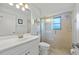 Clean bathroom featuring glass enclosed shower stall and modern vanity at 69 Bunker Rd, Rotonda West, FL 33947