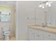 Cozy bathroom featuring white vanity and tiled walk-in shower at 69 Bunker Rd, Rotonda West, FL 33947