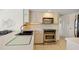 Well-equipped kitchen with stainless steel appliances and ample counter space at 69 Bunker Rd, Rotonda West, FL 33947