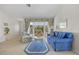 Beautiful living room featuring a large window, comfortable furniture, and tile floors at 69 Bunker Rd, Rotonda West, FL 33947
