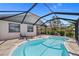 Relaxing pool area with a sun lounger for enjoying sunny days, and a tranquil atmosphere for ultimate relaxation and enjoyment at 69 Bunker Rd, Rotonda West, FL 33947