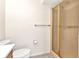 Bathroom featuring a shower, toilet, and towel rack at 6916 Rex Ln, Sarasota, FL 34243