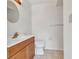 Bathroom featuring a vanity, toilet, and tiled flooring at 6916 Rex Ln, Sarasota, FL 34243