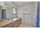 Bathroom features a single sink vanity with a large mirror and a shower/tub combo at 6916 Rex Ln, Sarasota, FL 34243