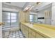 Neutral bathroom with a vanity and large mirror next to a combination shower and tub at 6916 Rex Ln, Sarasota, FL 34243