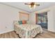 Cozy bedroom with wood flooring and sliding glass doors to the outdoor patio area at 6916 Rex Ln, Sarasota, FL 34243