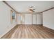 Spacious main bedroom featuring hard surface flooring and a walk-in closet at 6916 Rex Ln, Sarasota, FL 34243