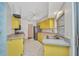 Eat-in kitchen with views of the side door entry and stainless steel refrigerator at 6916 Rex Ln, Sarasota, FL 34243