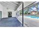 Open screened lanai with access to the pool deck and outdoor relaxation at 6916 Rex Ln, Sarasota, FL 34243