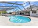 Screened-in pool featuring a refreshing pool and poolside patio, perfect for outdoor enjoyment at 6916 Rex Ln, Sarasota, FL 34243