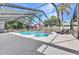 Screened-in pool area showcasing a pool, poolside patio, and comfortable lounge chairs at 6916 Rex Ln, Sarasota, FL 34243