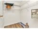 Bright walk-in closet with white wire shelving and neutral walls and flooring at 6916 Rex Ln, Sarasota, FL 34243