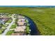 Stunning waterfront homes line the canal with boat docks and access to beautiful green scenery at 695 Macedonia Dr, Punta Gorda, FL 33950
