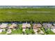 Overhead view of waterfront homes with canal access, docks, and palm-lined streets at 695 Macedonia Dr, Punta Gorda, FL 33950