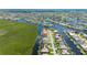A picturesque neighborhood featuring waterfront homes with canal access and beautifully landscaped yards at 695 Macedonia Dr, Punta Gorda, FL 33950
