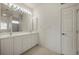 Bright bathroom featuring a double sink vanity, ceiling fan and walk-in shower at 695 Macedonia Dr, Punta Gorda, FL 33950