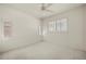 Bright bedroom featuring carpet, multiple shuttered windows and a ceiling fan at 695 Macedonia Dr, Punta Gorda, FL 33950