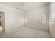 Bright bedroom with carpet, ceiling fan, closet and shuttered windows at 695 Macedonia Dr, Punta Gorda, FL 33950