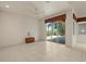 Bright bedroom features a ceiling fan and sliding glass doors to a screened patio at 695 Macedonia Dr, Punta Gorda, FL 33950