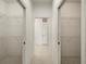 Hallway featuring two walk-in closets with wire shelving at 695 Macedonia Dr, Punta Gorda, FL 33950