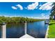Scenic waterfront view from the dock, showcasing a peaceful canal lined with trees at 695 Macedonia Dr, Punta Gorda, FL 33950
