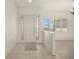 Bright foyer with tile flooring, decorative glass in the front door and windows, and a clear view of the living area at 695 Macedonia Dr, Punta Gorda, FL 33950