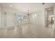 The home's entry features white tile flooring, decorative front door glass, and a clear view of the home's interior at 695 Macedonia Dr, Punta Gorda, FL 33950
