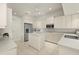 Bright kitchen with stainless steel appliances, white cabinets, and a kitchen island at 695 Macedonia Dr, Punta Gorda, FL 33950