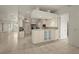 Spacious kitchen boasts an island with seating, modern appliances, and white cabinetry at 695 Macedonia Dr, Punta Gorda, FL 33950