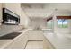 The bright kitchen features stainless appliances and a center island at 695 Macedonia Dr, Punta Gorda, FL 33950