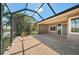 Spacious lanai with brick flooring and sliding doors to the home's interior at 695 Macedonia Dr, Punta Gorda, FL 33950