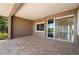 Spacious lanai with brick flooring and sliding doors to the home's interior at 695 Macedonia Dr, Punta Gorda, FL 33950