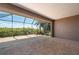 Spacious lanai with brick flooring and beautiful nature views from behind the screen at 695 Macedonia Dr, Punta Gorda, FL 33950
