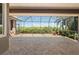 Spacious lanai with brick flooring and beautiful nature views from behind the screen at 695 Macedonia Dr, Punta Gorda, FL 33950
