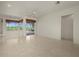 A spacious living room features tile floors and plenty of natural light at 695 Macedonia Dr, Punta Gorda, FL 33950