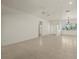 Expansive living area featuring bright tile, neutral paint, and natural light at 695 Macedonia Dr, Punta Gorda, FL 33950