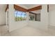 Sun-drenched living room with tile floor and sliding glass windows at 695 Macedonia Dr, Punta Gorda, FL 33950