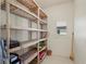 Well-lit storage space with sturdy shelving, offering ample room for organization and storage at 695 Macedonia Dr, Punta Gorda, FL 33950