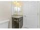 Bathroom with dark vanity and mirror at 7381 De Brita Rd, North Port, FL 34291