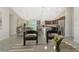 Spacious open-concept living room, dining room, and kitchen with ample natural light and neutral color palette at 7381 De Brita Rd, North Port, FL 34291