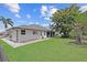 Large backyard surrounded by mature trees with lush green lawn perfect for outdoor activities and enjoyment at 7448 S Blue Sage, Punta Gorda, FL 33955