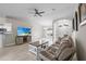 Open-concept living area with tile floors, modern furnishings, and ample natural light at 7448 S Blue Sage, Punta Gorda, FL 33955