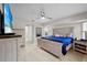 The main bedroom features a ceiling fan, bright natural light and an ensuite bathroom at 7448 S Blue Sage, Punta Gorda, FL 33955