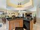 Kitchen sink and bar overlooks the living area at 85 Long Meadow Ct, Rotonda West, FL 33947
