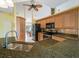 Well-lit kitchen with modern appliances, breakfast bar, and backsplash at 85 Long Meadow Ct, Rotonda West, FL 33947