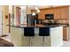Kitchen featuring stainless appliances, breakfast bar, and views of adjacent dining area at 85 Long Meadow Ct, Rotonda West, FL 33947